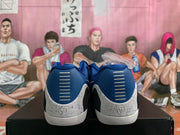 Rear view showing blue heel panels and speckled white accents