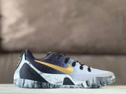 Side view of white Nike Kobe 9 GiGi sneakers with gold Swoosh branding, dark upper panels, and a gray marbled outsole.