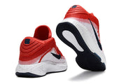 Red and white Nike GT Hustle 3 shoes shown from heel and outsole angles.