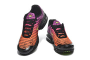 Top view of a pair of Nike Air Max Plus VI sneakers with black laces and gradient uppers.