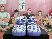 Front view showing purple laces, white toe boxes, all-over graphic lettering, and translucent purple outsoles.