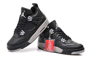 Angled pair of black high-top sneakers showing the grey midsole and heel construction.