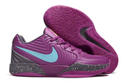 Purple Nike Ja 2 shoe with turquoise side logo beside the patterned outsole