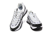 Front view of black and white Nike Air Max 97 sneakers with white laces.