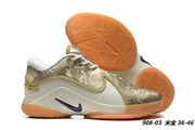Cream and gold Nike LeBron 22 sneakers with a camouflage-patterned upper, orange outsole, and style code FZ7308-100.
