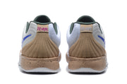 Rear view of the white Jordan sneakers showing tan-gold heel panels, dark green collars, and speckled midsoles.