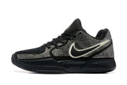 Side profile of a black Nike sneaker with a contrasting light-colored Swoosh, silver rhinestone-style upper detailing, and a low-cut sole.