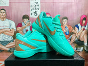 Turquoise Nike basketball shoes shown from the side, highlighting textured uppers and gold-tone Swooshes