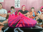 Side view of pink and purple Nike basketball shoes showing the patterned upper and Zoom marking on the sole