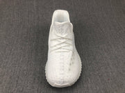 Top-down view of the white sneaker showing the rounded toe and lace layout.