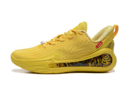 Side profile of a yellow sneaker showing the patterned upper and translucent-patterned heel panel.