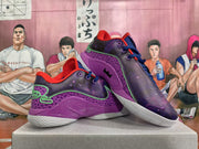 Pair of purple galaxy-print Nike basketball shoes displayed from a side and front angle.