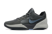 Side profile of a gray Jordan sneaker with a contrasting Swoosh and layered sole.