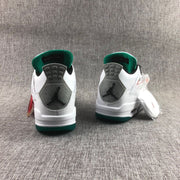 Rear view showing the grey speckled heel panels, black Jumpman logos, green collars, and green outsole edges.
