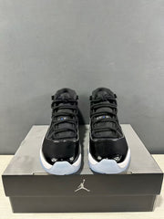 Front view of the pair showing black laces, glossy black toe panels and white midsoles.