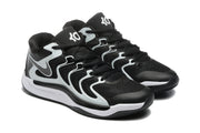 Three-quarter view of the paired black and white sneakers with lace-up closures and visible Nike and KD-style branding.