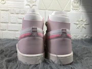 Rear view showing the pink heel panels, white trim, and ankle collars.