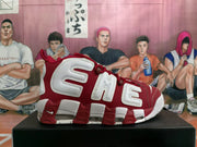 Side view showing oversized AIR lettering on a red and white sneaker