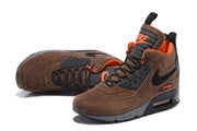 Angled views showing the brown upper, black side detail and orange accents on the Nike Air Max 90 Winter Sneakerboot.