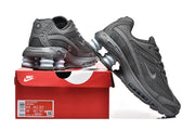 Dark grey Nike Shox Ride 2 sneakers displayed on a Nike box with a size label