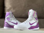 Pair of white and purple high-top basketball shoes shown from a front three-quarter angle.