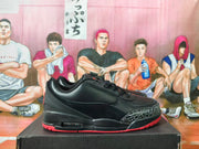 Side view of black low-top sneakers with patterned toe overlays and a red outsole.