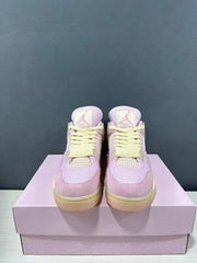 Front view showing the pink toe boxes, pale yellow laces, mesh panels, and tongue logos.