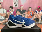 Side profile of a blue Nike basketball sneaker with white Swoosh branding and a layered white outsole.