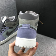 Close-up of the heel with a purple panel, gray collar, and white outsole.
