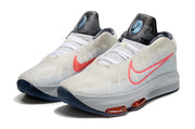 Light gray Nike GT Hustle 3 pair with coral Swoosh accents and dark patterned tongues.