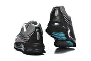 Rear and outsole views of grey and black Nike Air Max 97-style sneakers with turquoise details