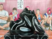 Pair of black and grey Jordan sneakers shown at an angle