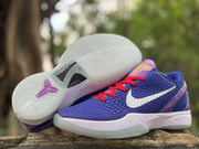 Nike Kobe 6 sneakers displayed with one outsole facing upward, showing the pale translucent outsole and purple Kobe emblem.
