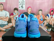 Rear view showing translucent heel sections, blue midsoles, and green signature-style heel graphics.