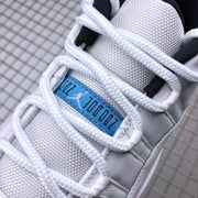 Close-up of the white laces, textured tongue, and blue Jordan tongue label.