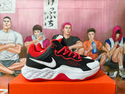 Side view of a black Nike basketball shoe with a white Swoosh, red laces and red accents.