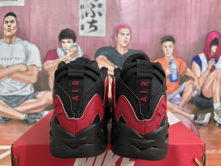 Rear view of red and black Nike sneakers with black heel tabs and chunky soles