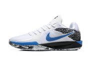 Side profile of a white Nike basketball shoe with a blue Swoosh and patterned heel