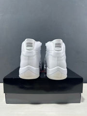 Rear view of white high-top sneakers showing heel tabs, stitching, and translucent outsole sections.