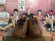 Top-front view of brown lace-up sneakers with textured tongues and a sculpted toe