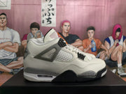 Side view showing the white upper, mesh panel, speckled grey overlays, and black outsole