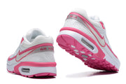 Rear and outsole views of white and pink Nike Air Max BW-style sneakers.