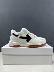 Side profile of the white low-top sneaker with black arrow detailing and a gum-colored outsole.