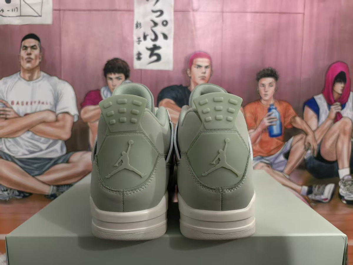 Rear view of gray high-top sneakers showing Jumpman heel logos and light-colored midsoles.