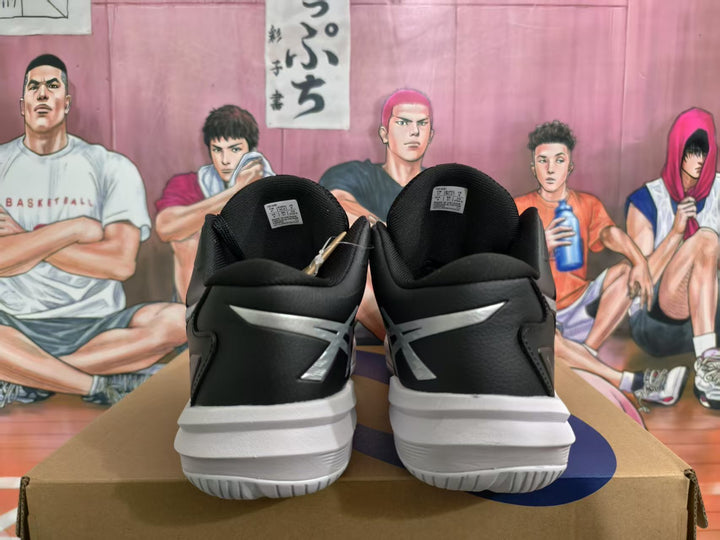 Rear view of black and white ASICS Sky Elite basketball shoes displayed on a box.