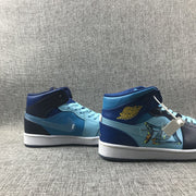 Pair of blue and navy mid-top sneakers displayed side by side, showing contrasting color blocking and side graphics.