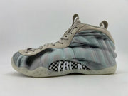 Beige, gray, and black abstract-pattern high-top sneaker with a translucent outsole.