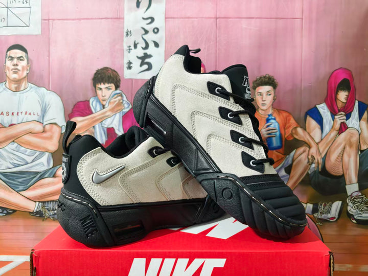 Pair of white and black Nike high-top basketball sneakers shown at an angle on a red Nike box.