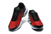 Top view of a pair of red and black Nike Air Max Plus sneakers.