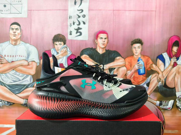 Side view of black and pink Under Armour basketball shoes with turquoise accents